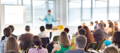 Photo of Man Presenting to Audience