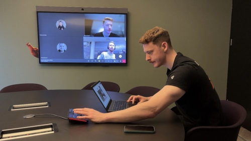 Gentlemen Controls Video System in Meeting Room